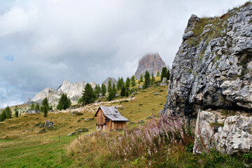 Sheep and a mountain hut in the wonderful landscape of the Dolomites mountains, South Tyrol, Italy