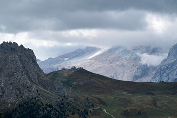 Great view of the Dolomites mountains with the glacier of the Marmolada in the background and a fantastic light and clouds condition, South Tyrol, Italy