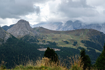 Great view of the Dolomites mountains with the glacier of the Marmolada in the background and a fantastic light and clouds condition, South Tyrol, Italy