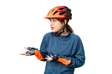 Young cyclist girl over isolated chroma key background with surprise facial expression