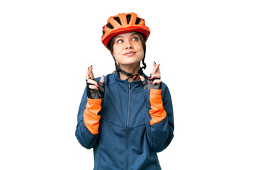 Young cyclist girl over isolated chroma key background with fingers crossing