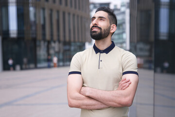 Portrait of Arab Arabian young handsome happy muslim bearded man with beard in casual clothes,...