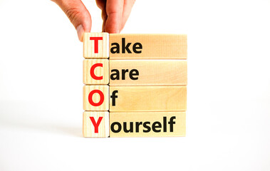 TCOY take care of yourself symbol. Concept words TCOY take care of yourself on wooden block on...