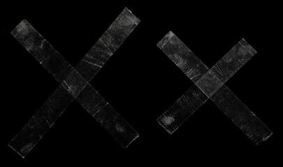 two sets of transparent sticky tapes forming the letter x or overlapping each other on black...