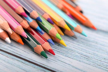 Color pencils isolated on wooden background	
