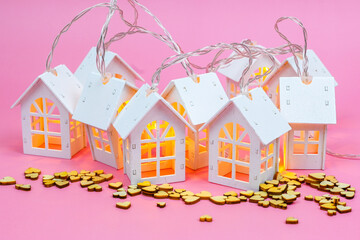 Group of houses with lights and wooden heart, community, villages, association , cooperation concept