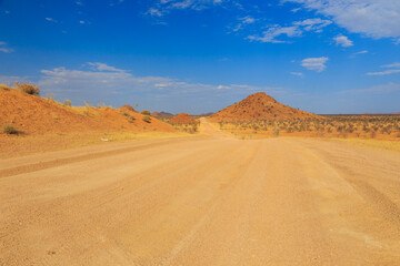 Fototapeta premium Namibian landscape along the gravel road. Damaraland, homelands in South West Africa, Namibia.