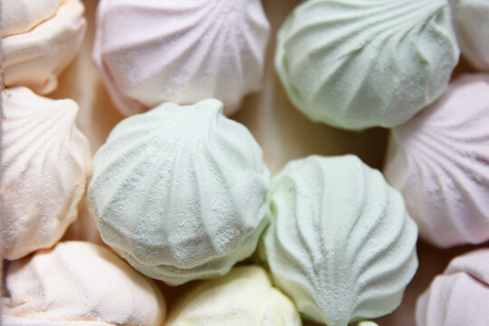 Freshly prepared packaged multicolored air marshmallow according to a classic recipe at a confectionery factory, lies for sale to customers