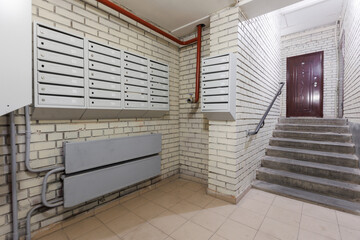 mailboxes in the lobby of an apartment building