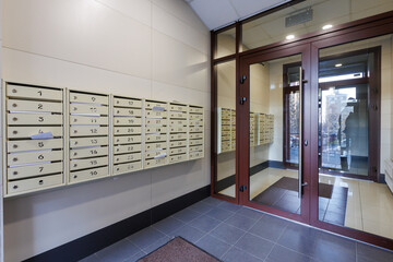 mailboxes in the lobby of an apartment building