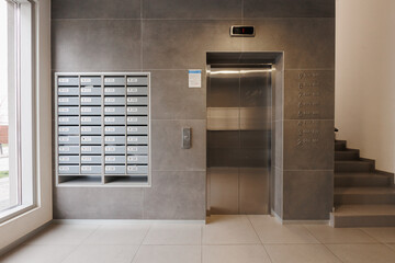 mailboxes in the lobby of an apartment building
