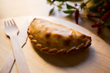Argentine empanada stuffed with minced beef and tomato.