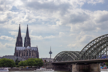 Cityscape of Cologne with Hohenzollern bridge, cathedral, Saint Martin church and Rin river in Germany
