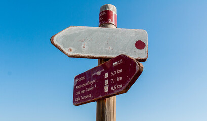 A path sign on the Cami de Cavalls coastal walk in Minorca island.