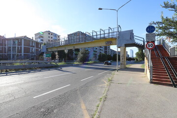 Concrete footbridge over motorway. Stock photo.	