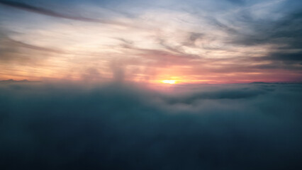 Fototapeta na wymiar above the clouds at sunrise 