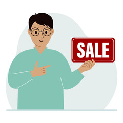 A man holds a banner with the text sale. Points a finger at the text. The concept of a discount, a special offer in a store or a bank, an advertising flyer.