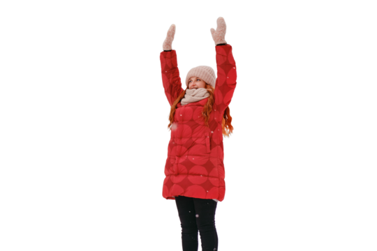A happy woman is engaged in sports exercises during a training session in a winter forest with trees in the snow, isolated on a white background