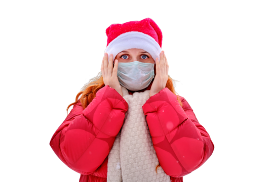 A frightened woman holds her head in a medical face mask, a winter park with trees in the snow, isolated on a white background