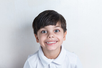 Cute boy with white shirt on white background