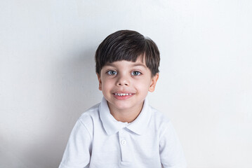 Cute boy with white shirt on white background