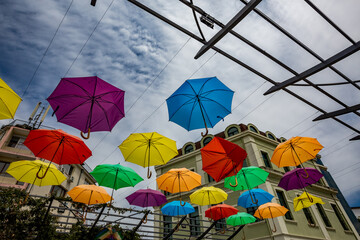 Umbrellas above the street, in many colors. Burgas, Bulgaria