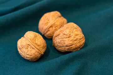 Walnut on the table. Tree fruit in shell. Natural herbal food ingredient Nutritious nut for health Closeup photo