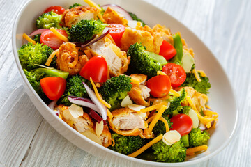 fried chicken tenders broccoli salad in bowl
