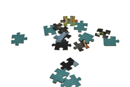 Puzzles randomly scattered on the table.