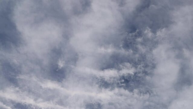 timelapse video with white clouds running on sky. cloudscape with white cumulus clouds 