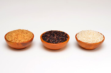 bowls with different types of chinese rice on a white background