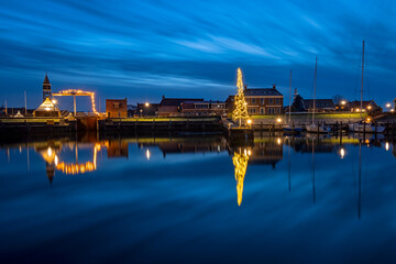 The traditional city Hindeloopen in christmas time in Friesland the Netherlands at sunset