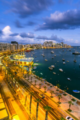 Evening at Sliema Bay promenade in Malta. Illuminated cityscape