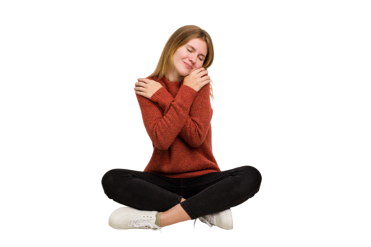 Young caucasian woman sitting on the floor cutout isolated