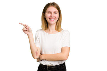 Young caucasian woman isolated smiling cheerfully pointing with forefinger away.