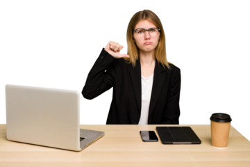 Young business caucasian woman working on her workplace cutout isolated showing a dislike gesture, thumbs down. Disagreement concept.