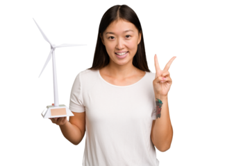 Young asian woman holding a small wind energy mill isolated showing number two with fingers.