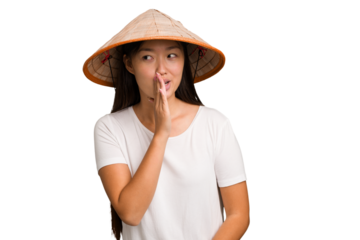Young asian woman wearing a Vietnamese hat isolated is saying a secret hot braking news and looking aside