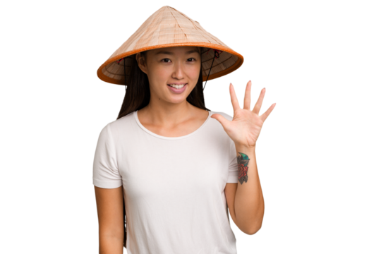 Young asian woman wearing a Vietnamese hat isolated smiling cheerful showing number five with fingers.