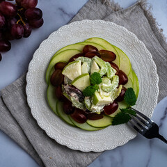 Traditional waldorf salad with apples, celery, walnuts, and grapes with a mayo dressing.
.