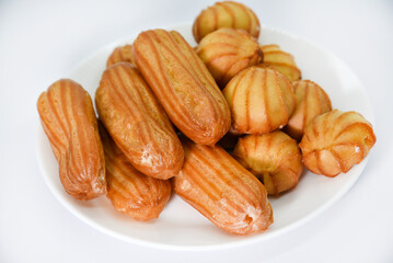 Custard cake with filling. Sweet eclairs. Flour cake with sweet filling.