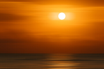 Fototapeta na wymiar Bright dramatic orange sunrise over Mediterranean sea. Oliva, Valencia, Spain