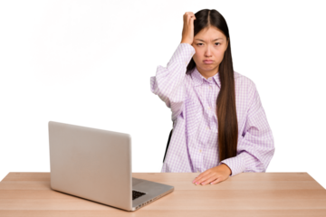 Young student asian woman in a workplace with a laptop isolated tired and very sleepy keeping hand on head.
