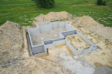 A foundation for a new house. The basement is already poured with concrete.