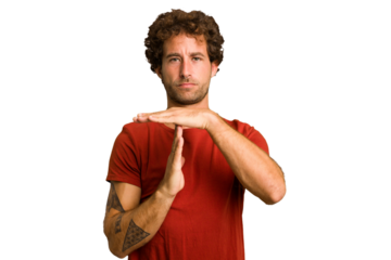Young curly smart caucasian man cut out isolated showing a timeout gesture.