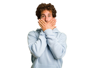 Young curly smart caucasian man cut out isolated shocked covering mouth with hands.