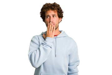Young curly smart caucasian man cut out isolated yawning showing a tired gesture covering mouth with hand.
