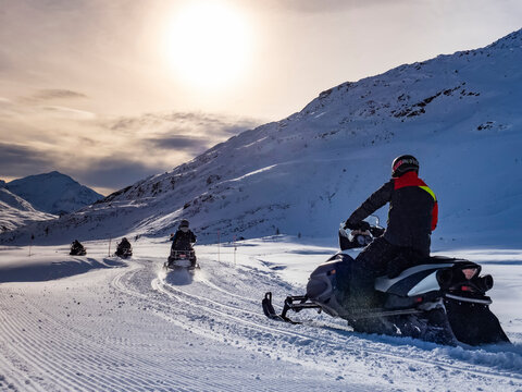 Snowmobile on a trail in the Italian alps