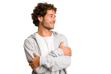 Young curly smart caucasian man cut out isolated smiling confident with crossed arms.