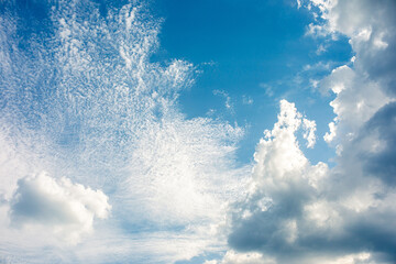 Naklejka na ściany i meble Sun rays in the cloudy sky. Nature background.
